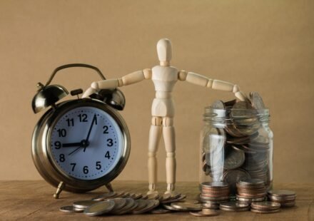 A toy compare clock and money